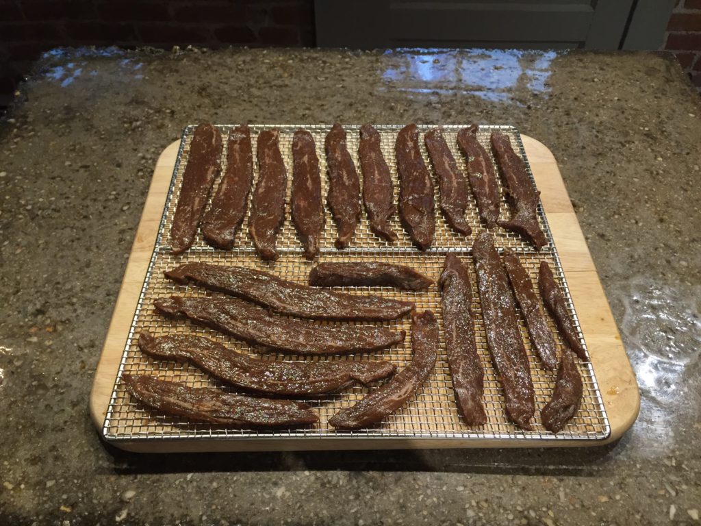 Marinated beef jerky on the drying rack Jerky, Pickles, and Beer